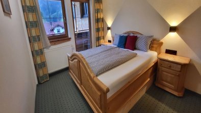 Schlafzimmer grün Ferienwohnung Tanne, © Englbertars Holzhof